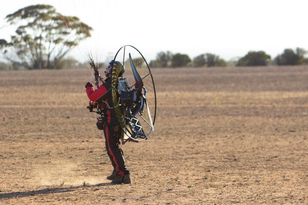 man-wearing-black-and-red-suit-during-daytime-jd1xo6bcod0